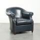 Dark blue cowhide club armchair with a unique and timeless design