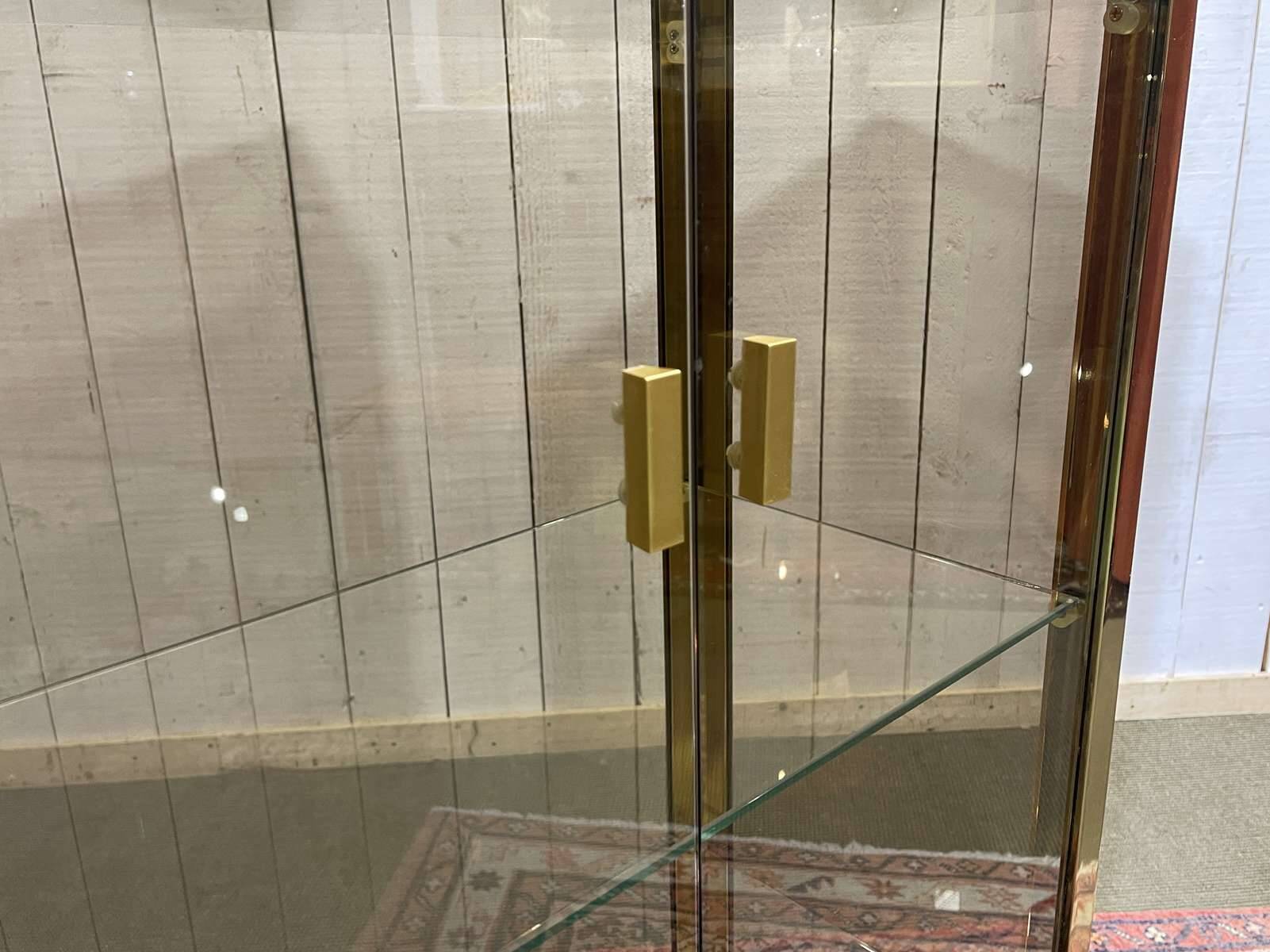 Exhibition showcase in gold-plated chrome and smoked glass - work from the 1980s.
