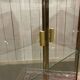 Exhibition showcase in gold-plated chrome and smoked glass - work from the 1980s.
