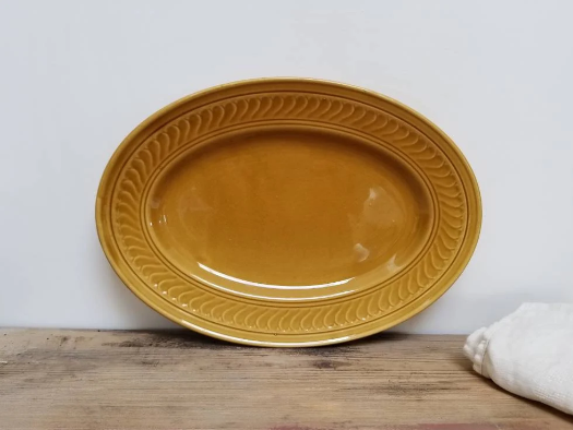 Serving dish in mustard gien earthenware