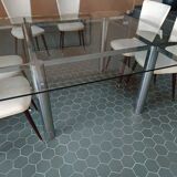 Designer table in glass and metal