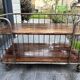 Industrial metal and wood serving trolley on wheels