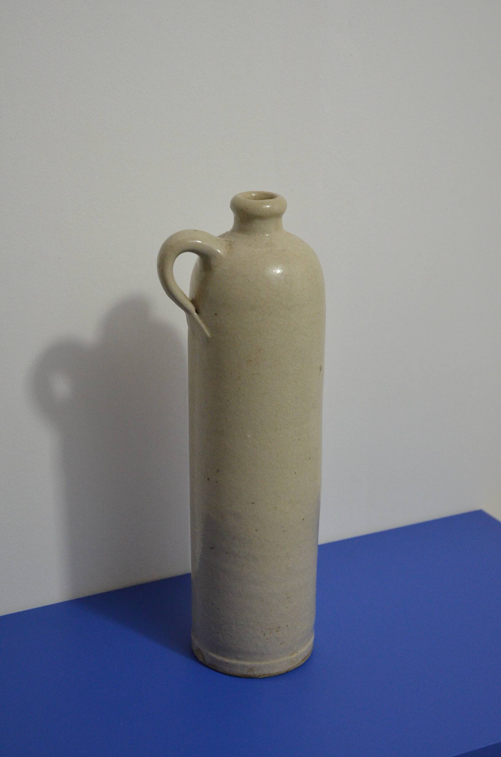 Stoneware bottle with handle