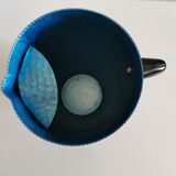 Vintage hammered blue metal pitcher