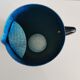 Vintage hammered blue metal pitcher