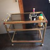 Brass and smoked glass bar trolley with casters