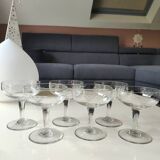 Set of 6 Baccarat-style champagne glasses. Stylized grape cluster decoration.