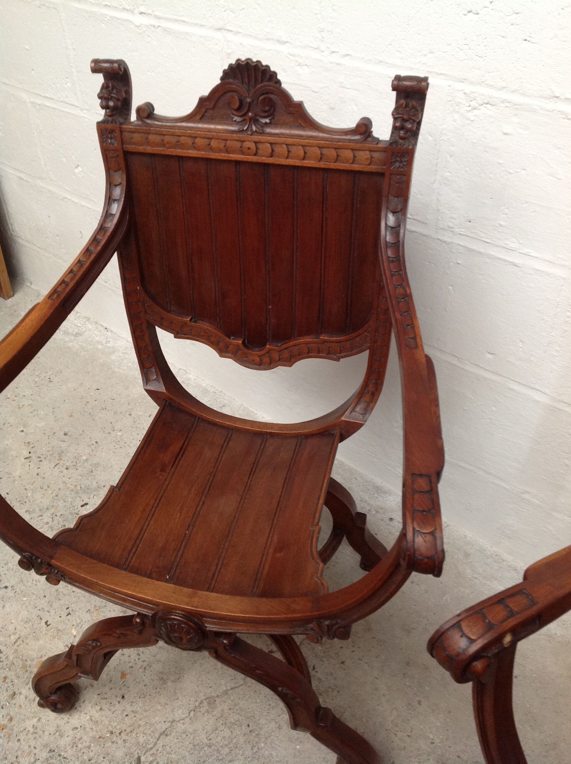 Pair of antique armchairs curules called Dagobert in carved wood