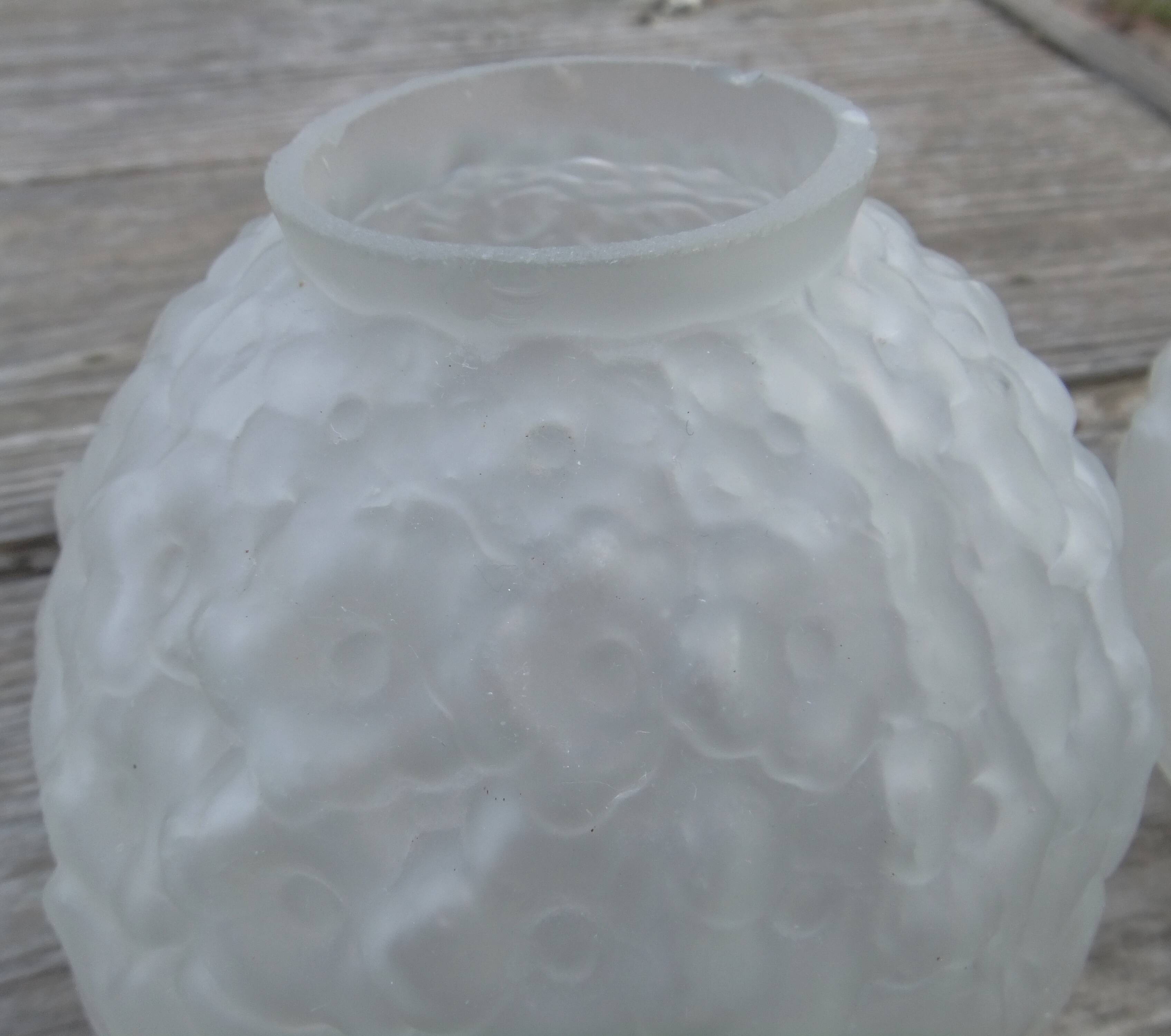 Art Deco ball vase pair with flower and leaf decor