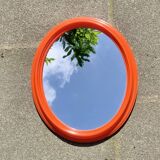 Vintage orange plastic oval wall mirror