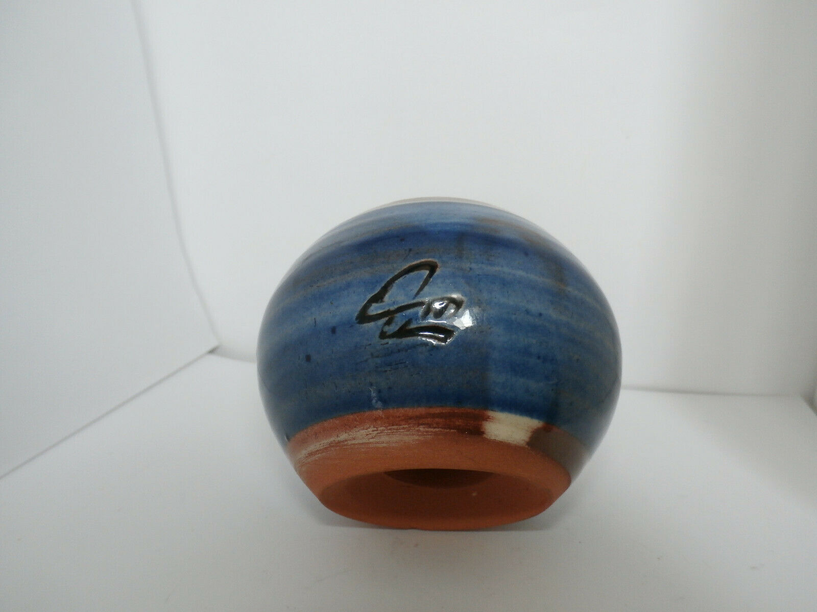 Glazed terracotta ball signed Otto Lindner