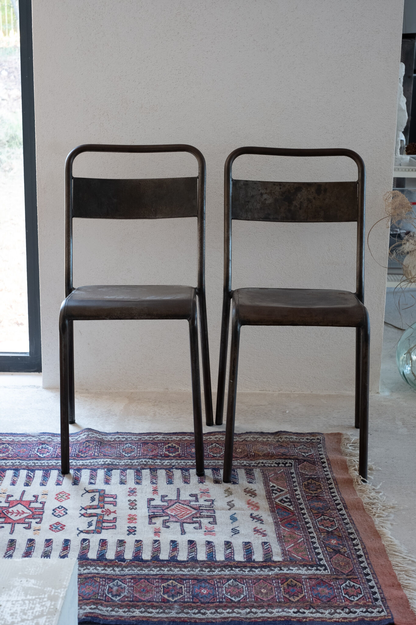 Pair of patinated metal chairs