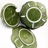 Soup pot of Portugal cabbage leaves in green slurry