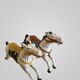 Pair of large hand-painted Indonesian horses with saddle