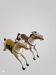 Pair of large hand-painted Indonesian horses with saddle