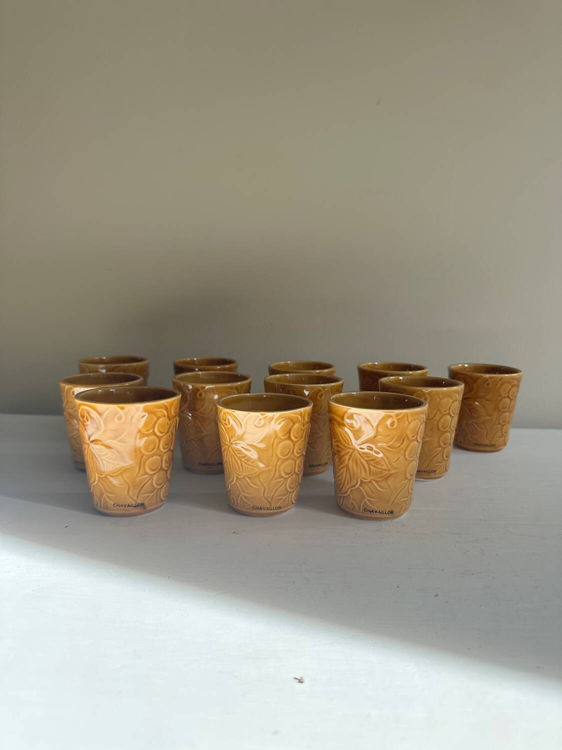 Set of 12 ochre Chavaillon de Sarreguemines cups