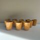 Set of 12 ochre Chavaillon de Sarreguemines cups
