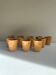 Set of 12 ochre Chavaillon de Sarreguemines cups
