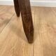 Small brutalist tripod stool in solid wood.
