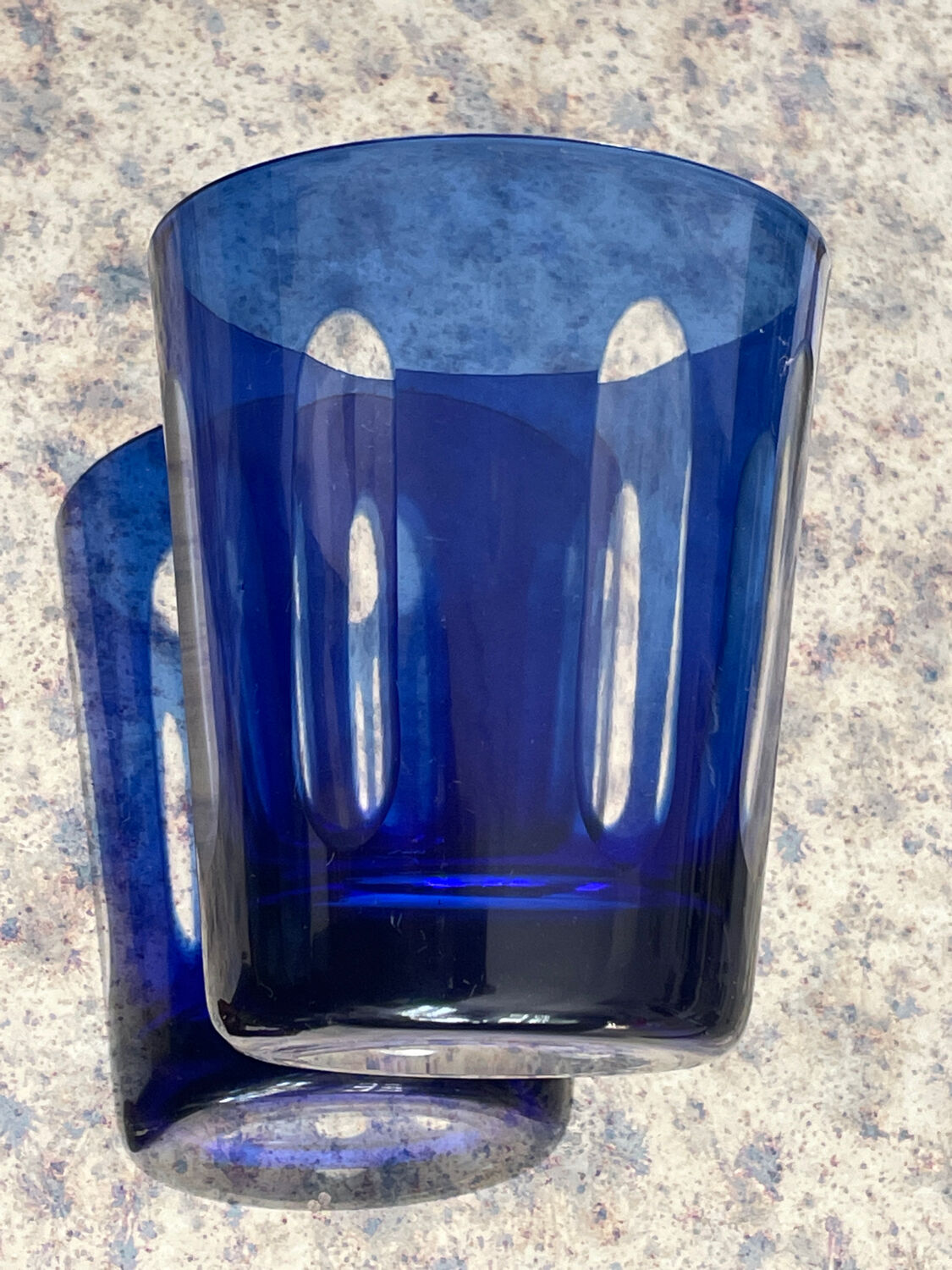 Antique crystal glass lined blue.