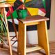 Art-populaire workshop stool in patinated painted wood