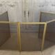 Five-panel golden metal fireplace screen from the 19th century.