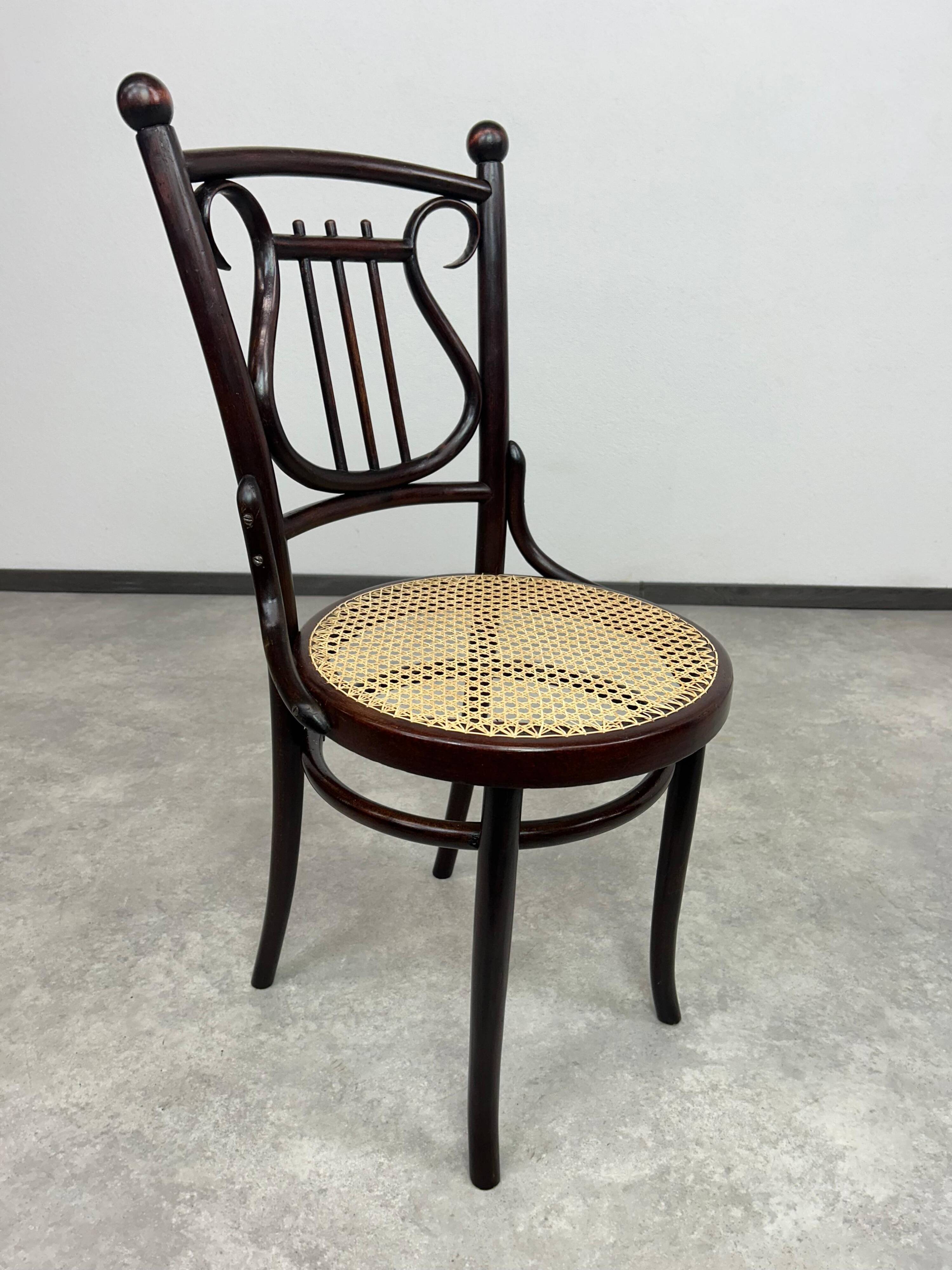 Curved wooden chair attributed to Thonet.