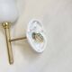Pair of brass torch wall lights with white opal glass and porcelain