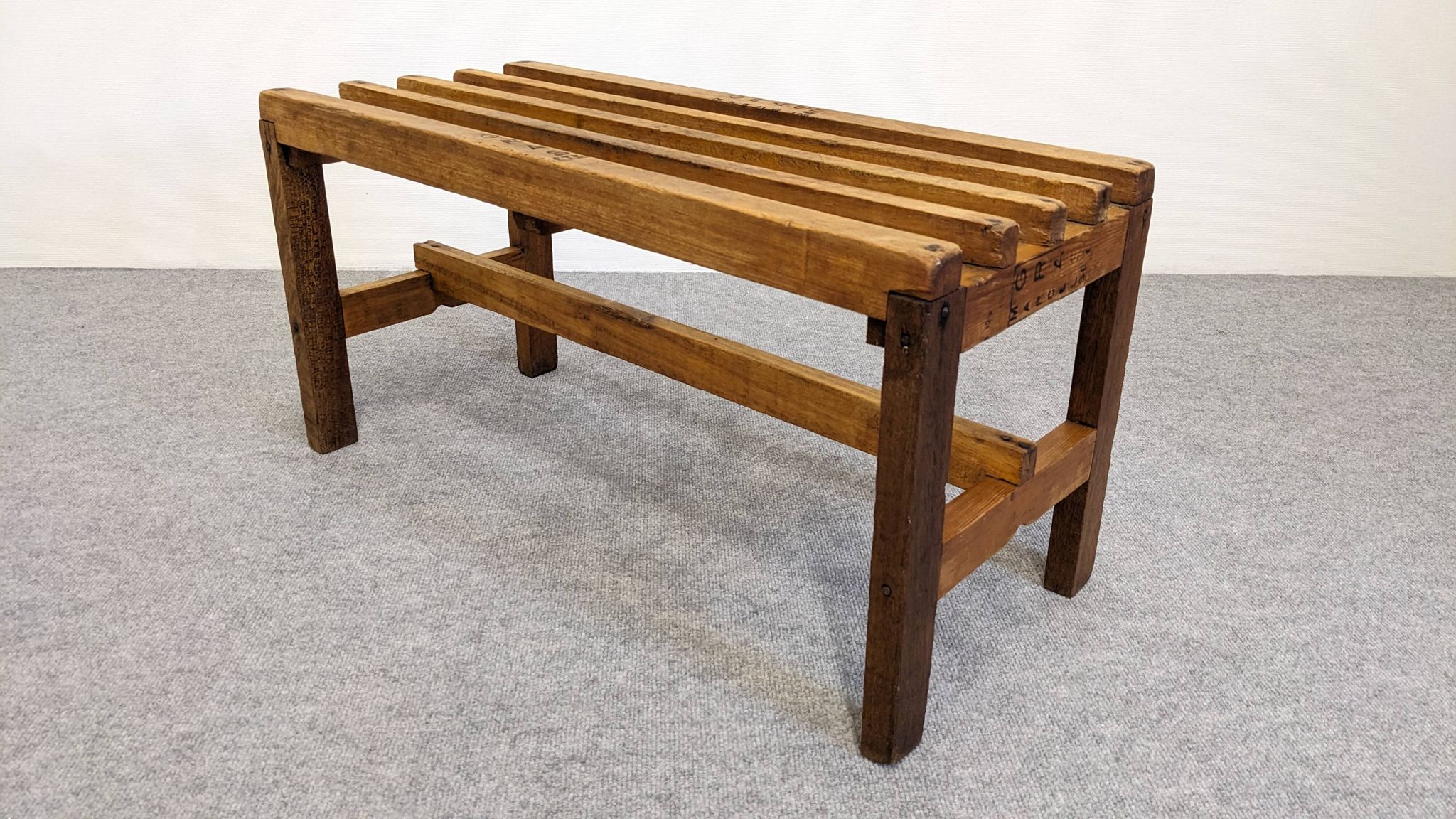 Wooden slatted display bench or support, France circa 1960.
