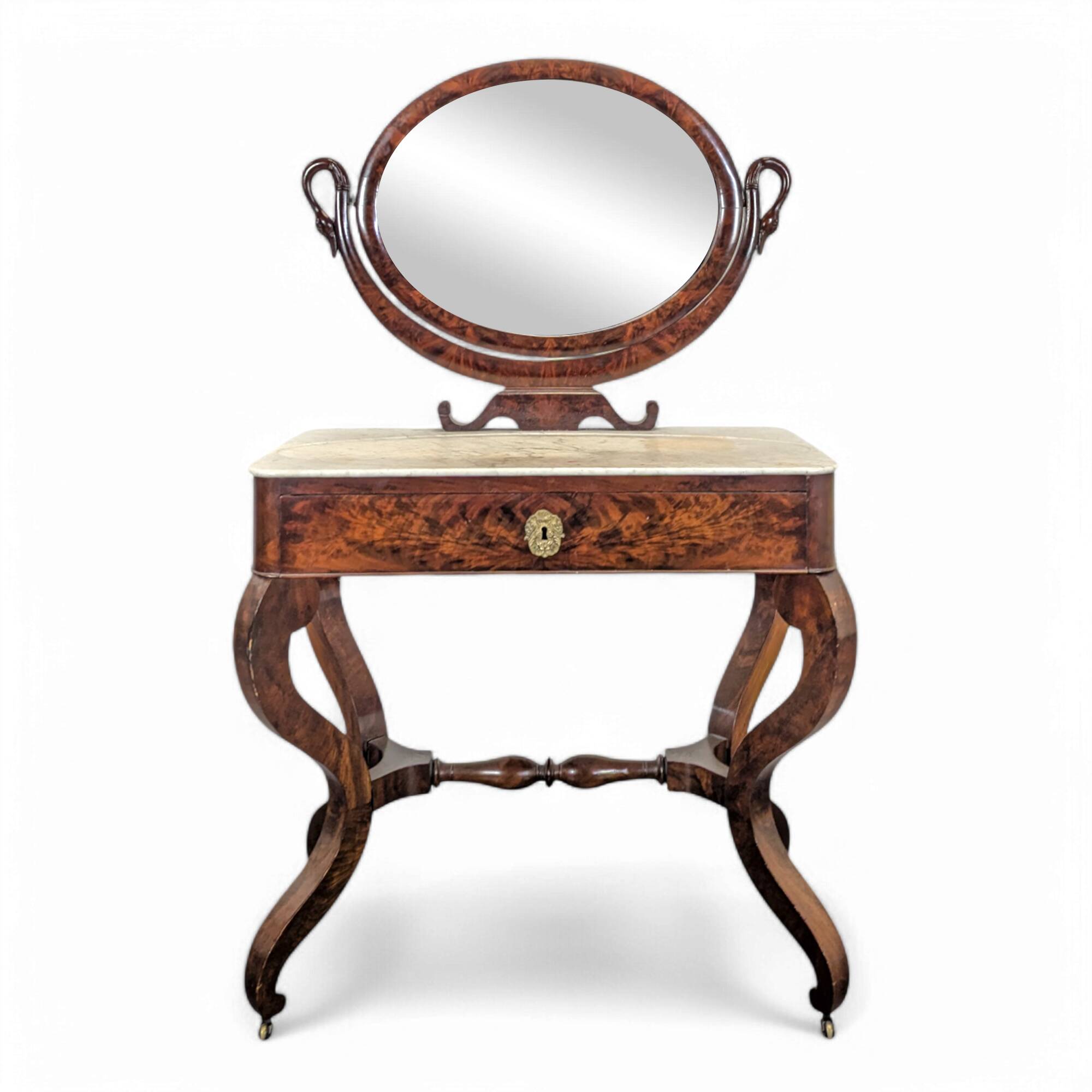 Restoration period flamed mahogany swan neck dressing table