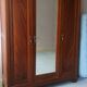 Old art nouveau 3-door wardrobe with mercury mirror
