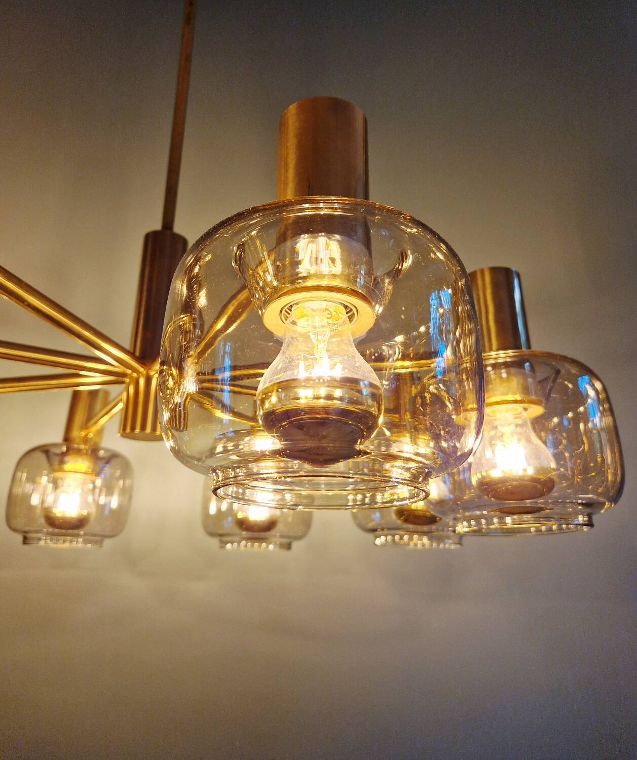 Large designer chandelier in brass and smoked glass globes, 1970s