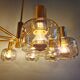 Large designer chandelier in brass and smoked glass globes, 1970s