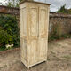 Small antique wardrobe with a faded white patina.