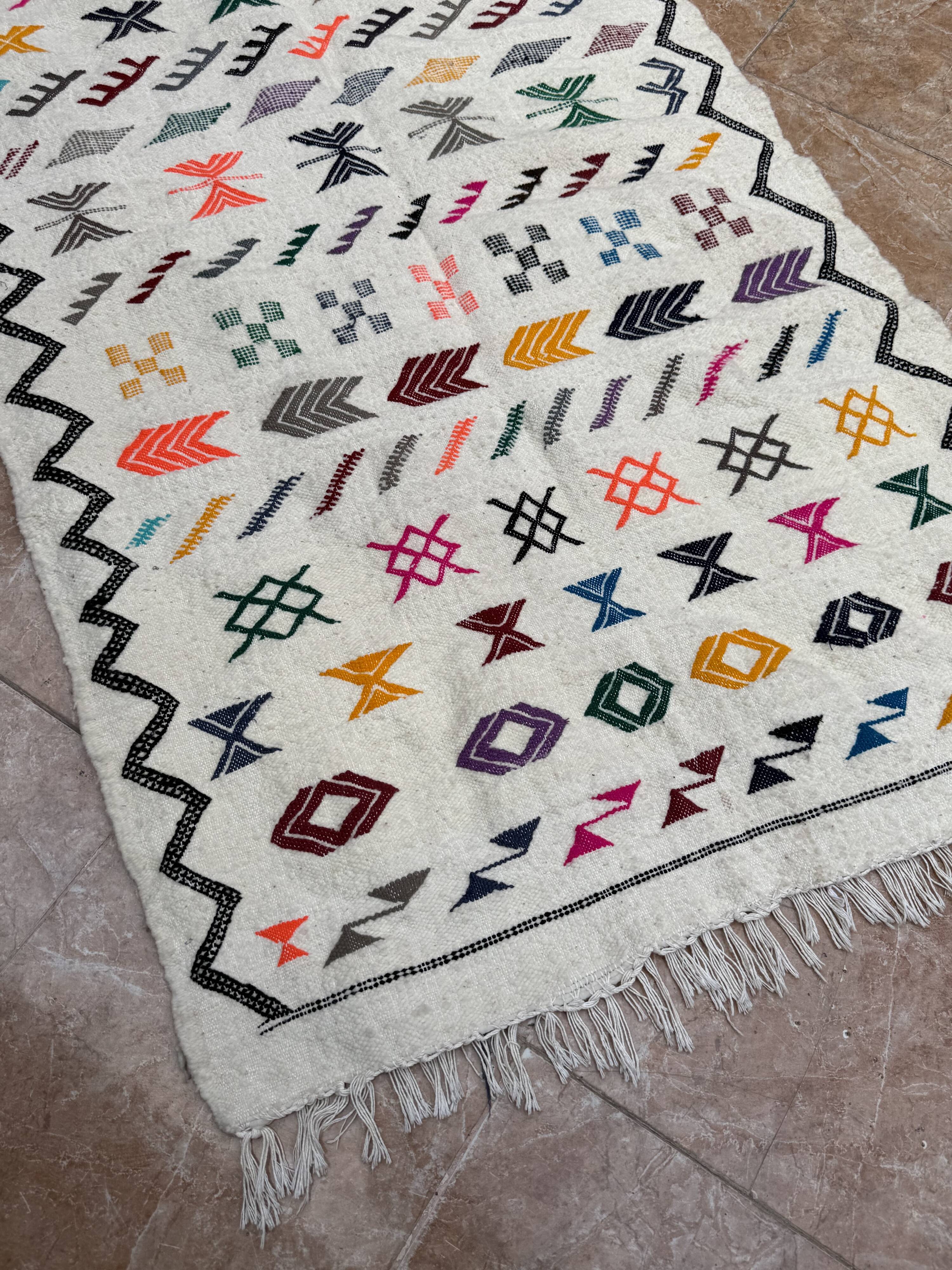 Handwoven Berber kilim rug: small Moroccan decorative rug.