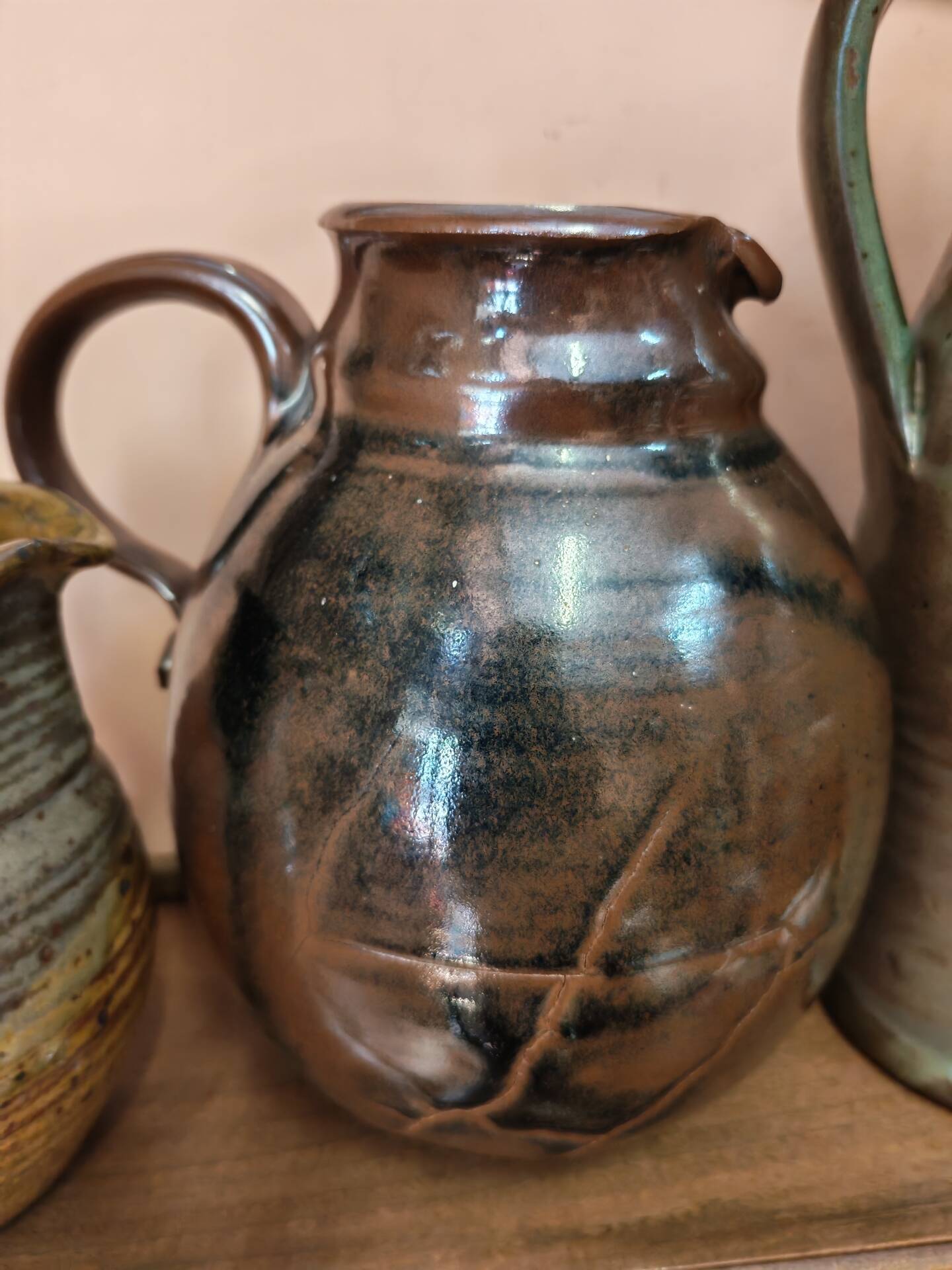 Set of three vintage ceramic jugs and a pitcher.