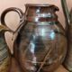 Set of three vintage ceramic jugs and a pitcher.