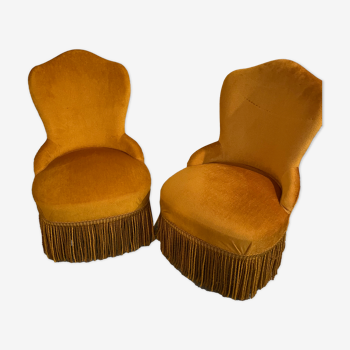 Two small mustard-colored toad armchairs