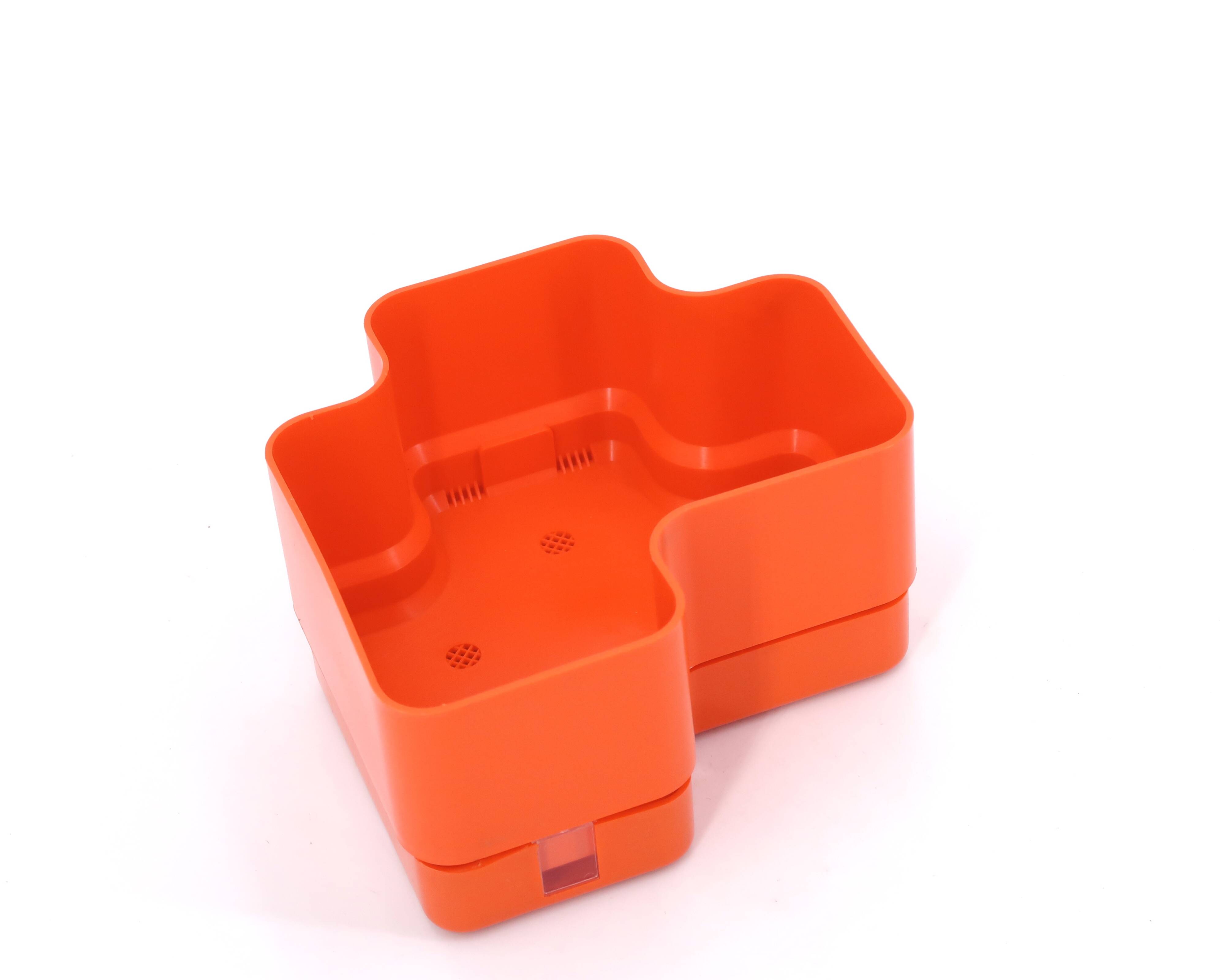 Vastill planter in orange plastic by Michael McCann