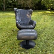 Egg chair style armchair and its ottoman.