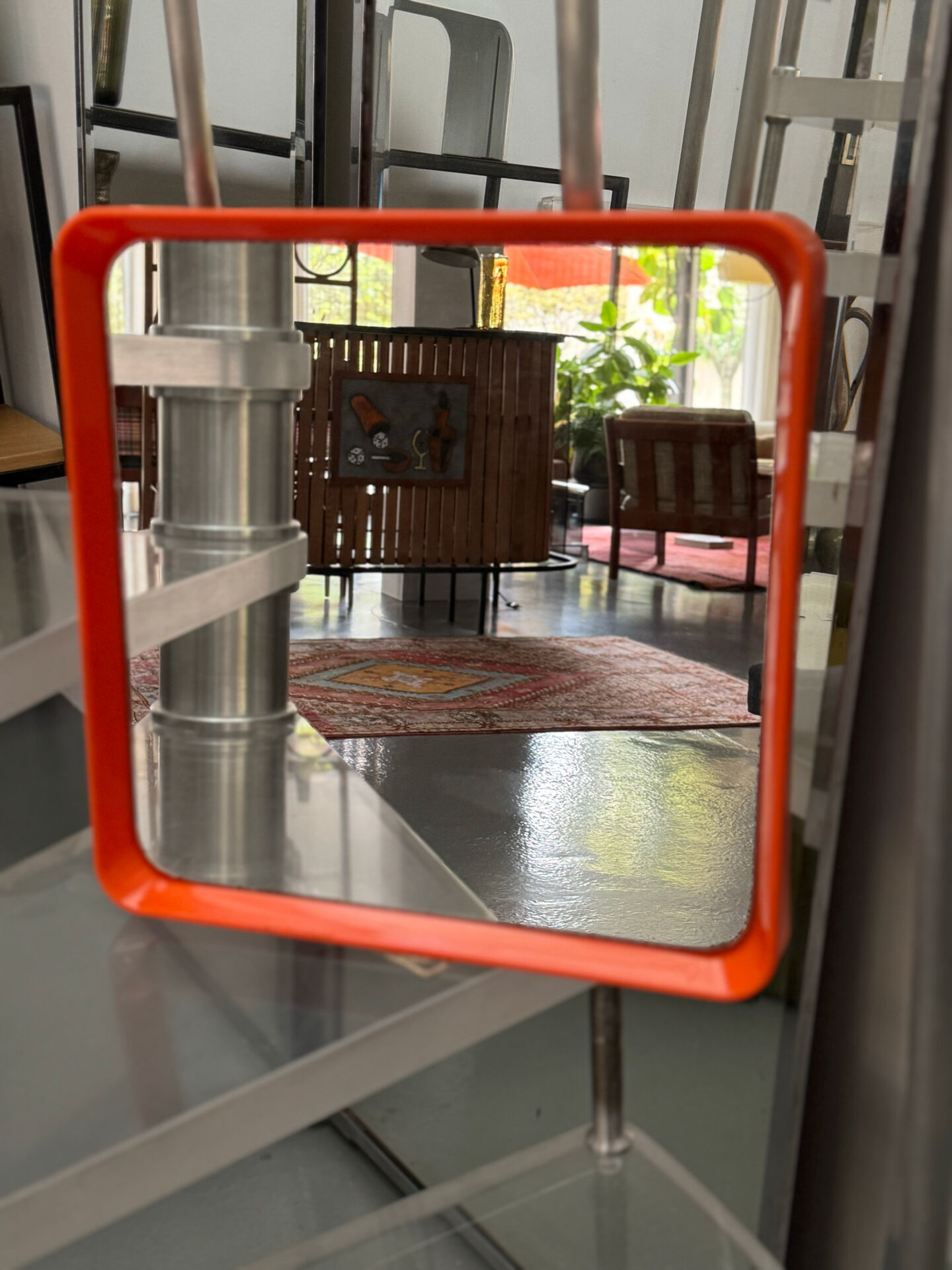 Orange moulded plastic mirror
