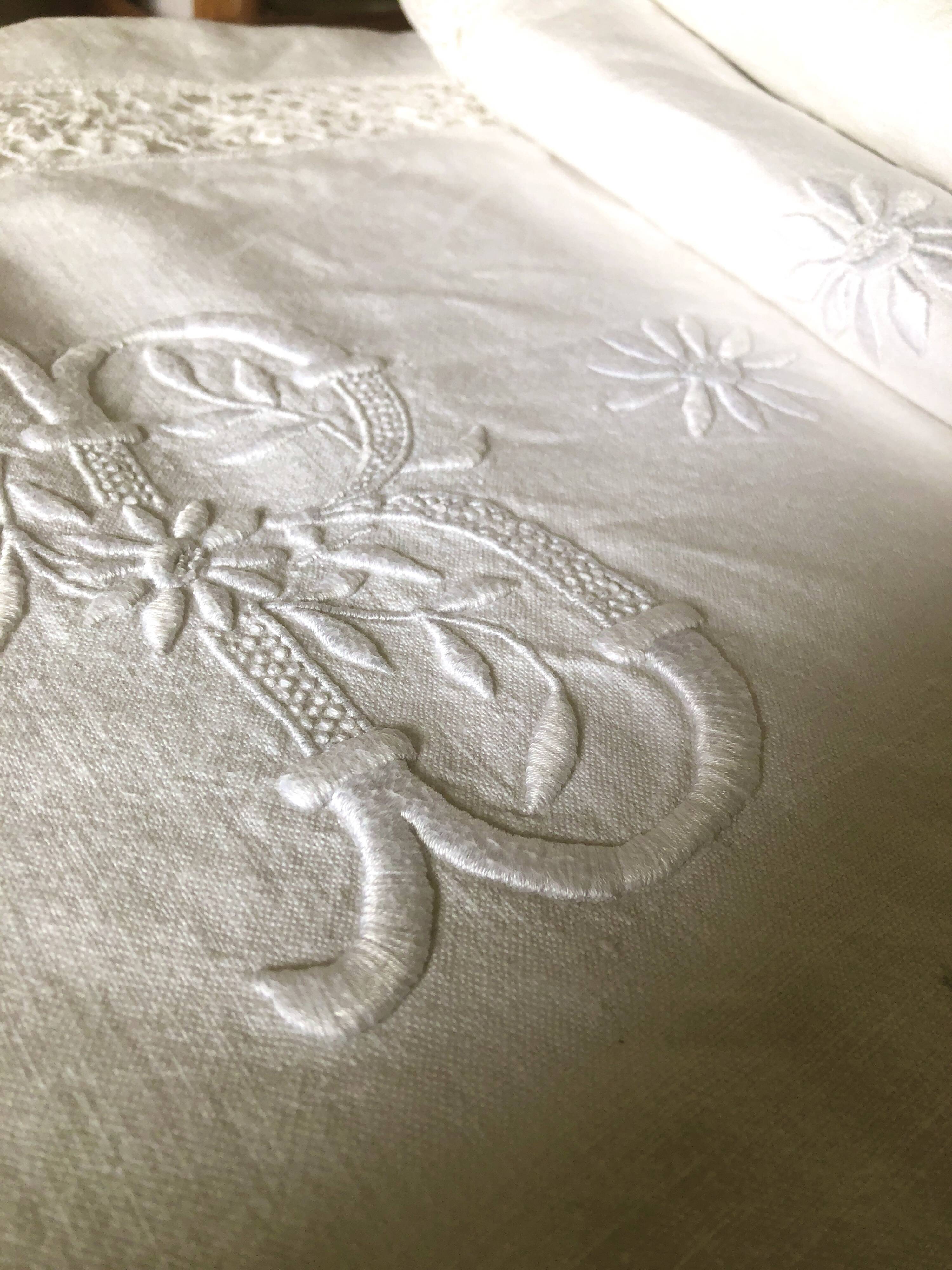 Old embroidered cloth, monograms and lace