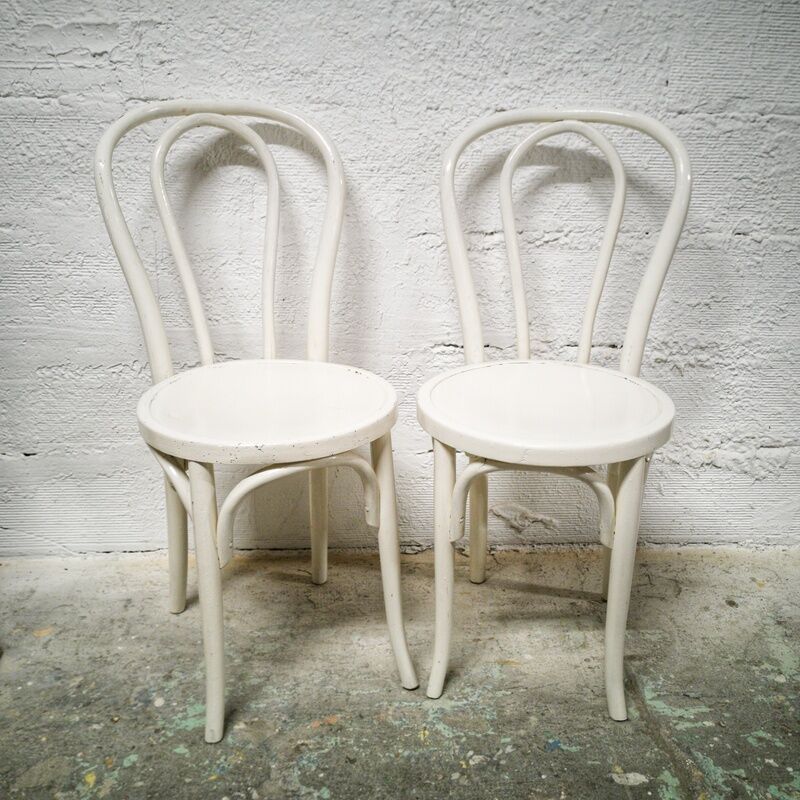 Pair of white Baumann bistro chairs