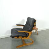 Fauteuil de lecture noir avec accoudoirs et support en bois