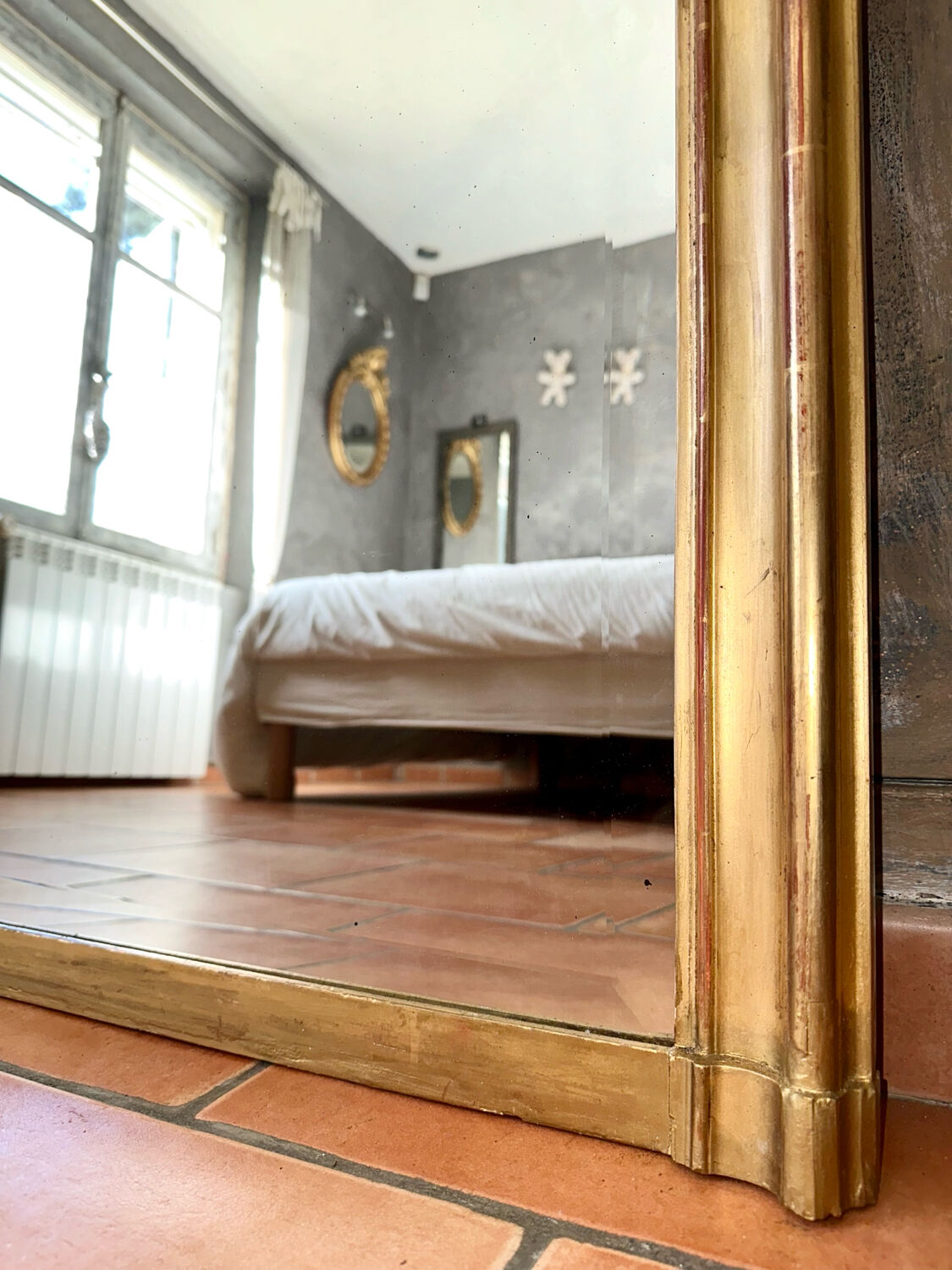 Antique gilded mirror with Louis XV pediment