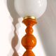Vintage lamp in orange turned wood and opaline globe