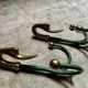 Rare set of swan neck coat hooks with mirror frame attributed to Maison Jansen, France, 1950s.