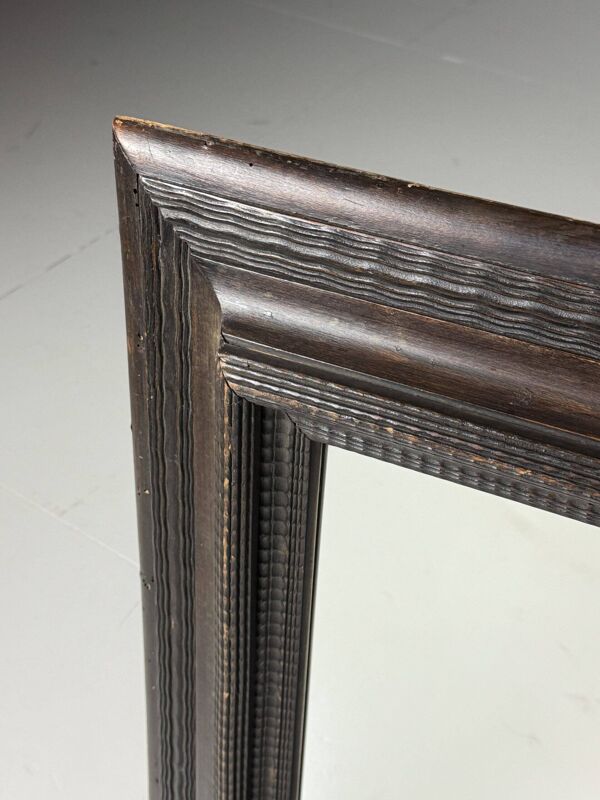 Miroir à cadre ondulé brun du XXe siècle