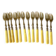 Antique dessert forks in brass and bakelite