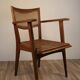 Vintage wooden armchair and canning 1950